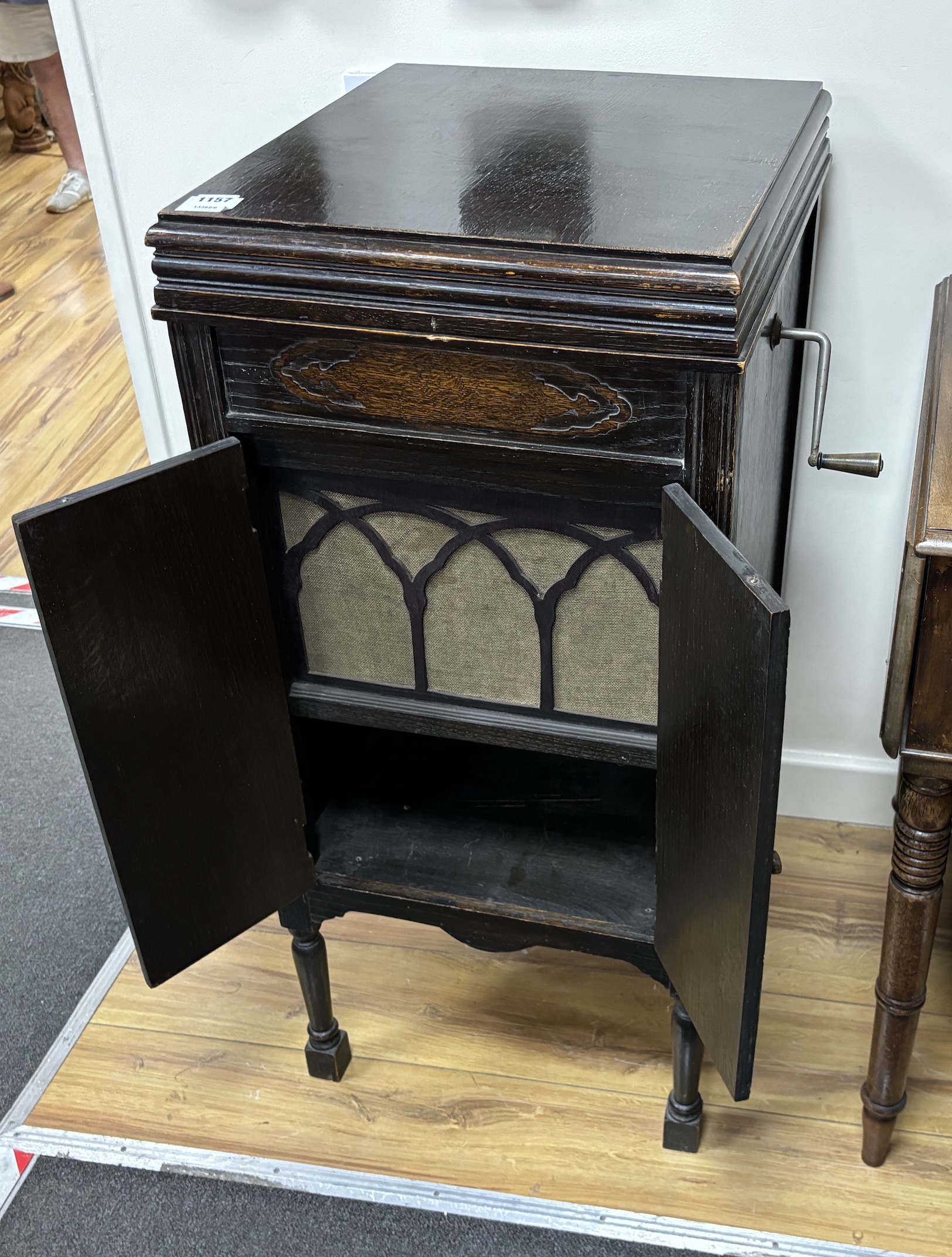 An early 20th century Fullotone oak cased wind-up gramophone, width 43cm, depth 48cm, height 93cm together with a small collection of records